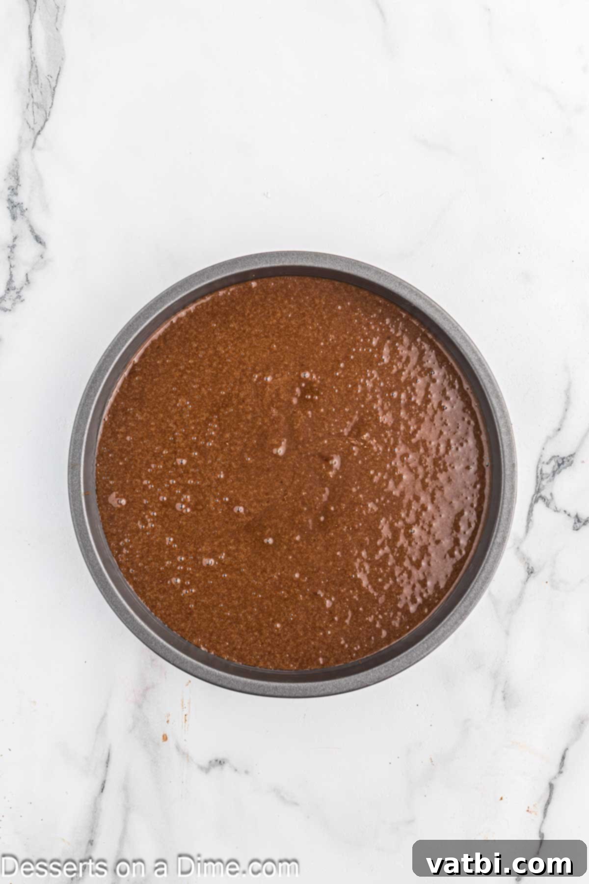 Cake batter spread into a pan. 