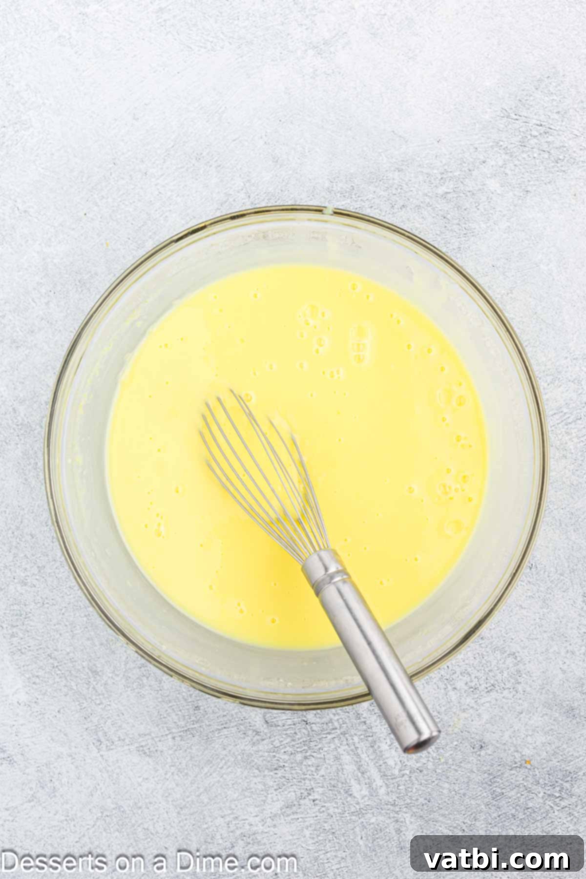 Zesty Lemon Layers 6 Lemon pudding mixture in a bowl, showing its creamy texture.