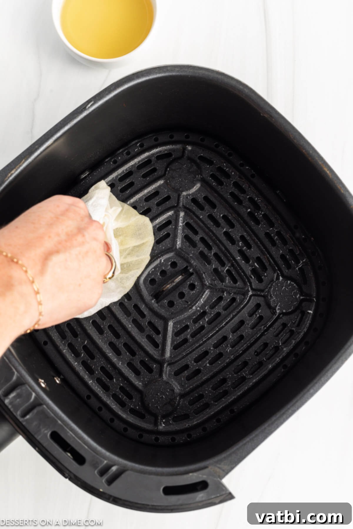 Delicious Air Fryer Donuts Made Easy 4 Air fryer basket coated.