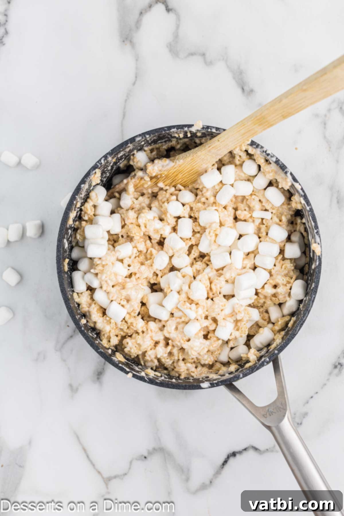 Starbucks Marshmallow Cloud Bar 6 Rice Krispies cereal and reserved mini marshmallows mixed into the melted marshmallow mixture in the pan.