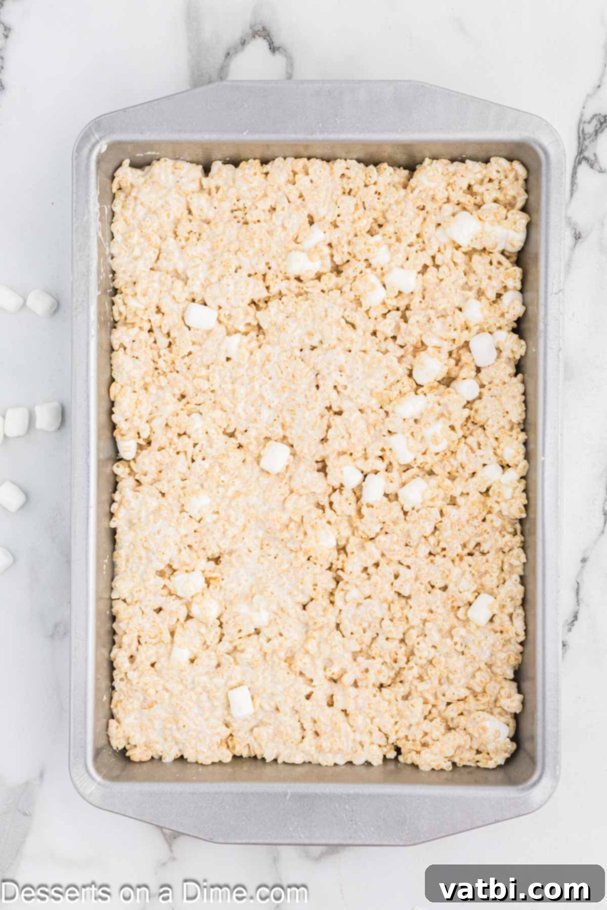 Starbucks Marshmallow Cloud Bar 7 Marshmallow and cereal mixture evenly pressed into a greased baking dish, ready to cool.