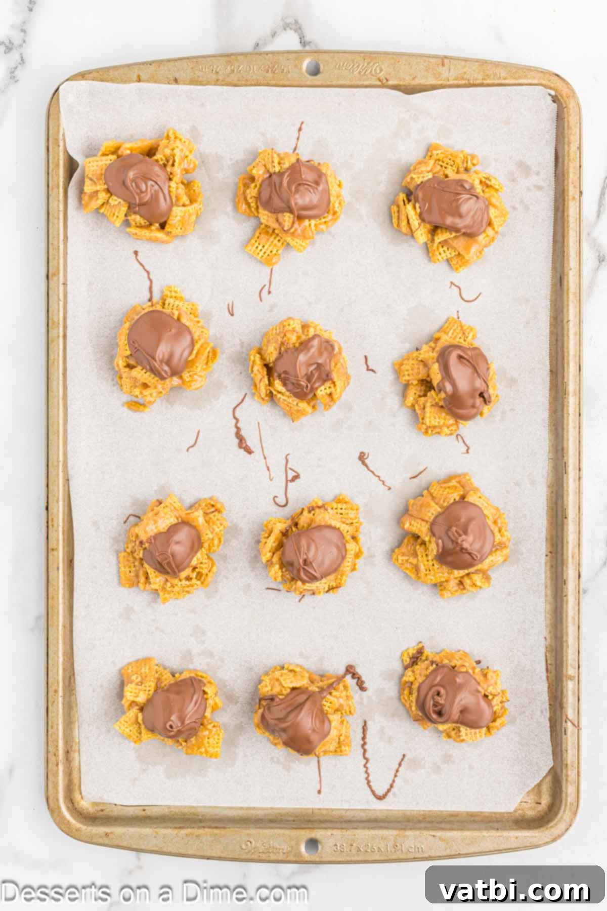 Scotcheroos Clusters on baking sheet cooling. 