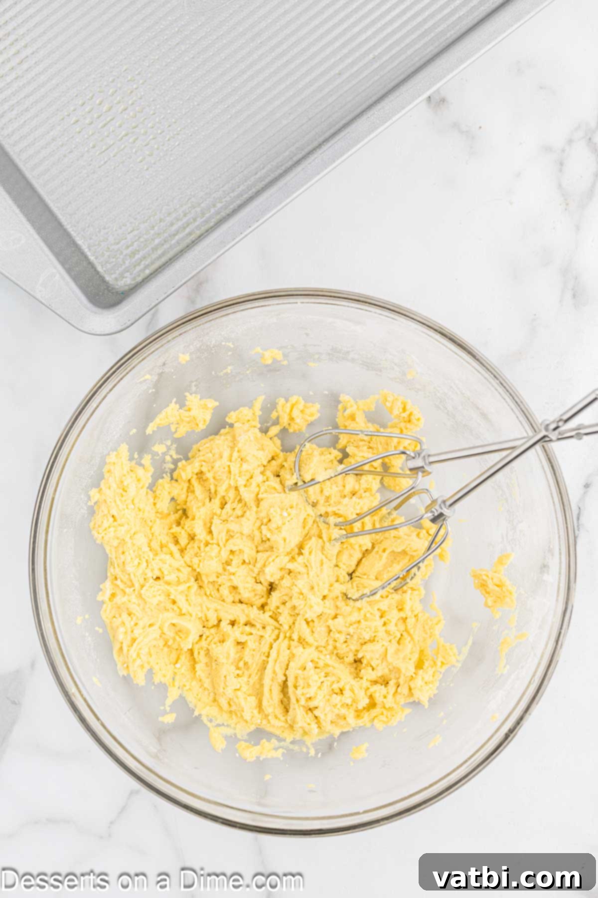 Paula Deen's Signature Ooey Gooey Butter Cake 4 Yellow cake mix ingredients combined in a mixing bowl for the crust.