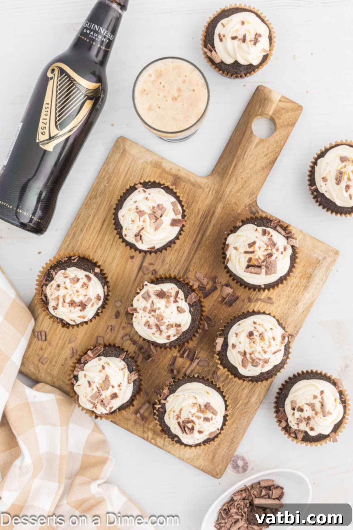 Velvet Stout Cupcakes 12 Guiness Cupcakes arranged on a wooden tray.