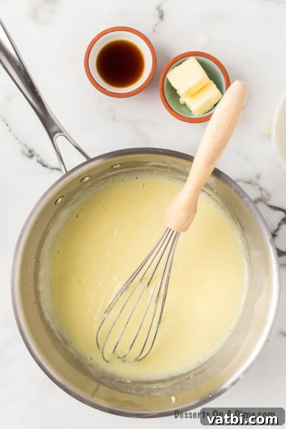 Creamy Homemade Vanilla Pudding 9 Mixture boiling in pan.