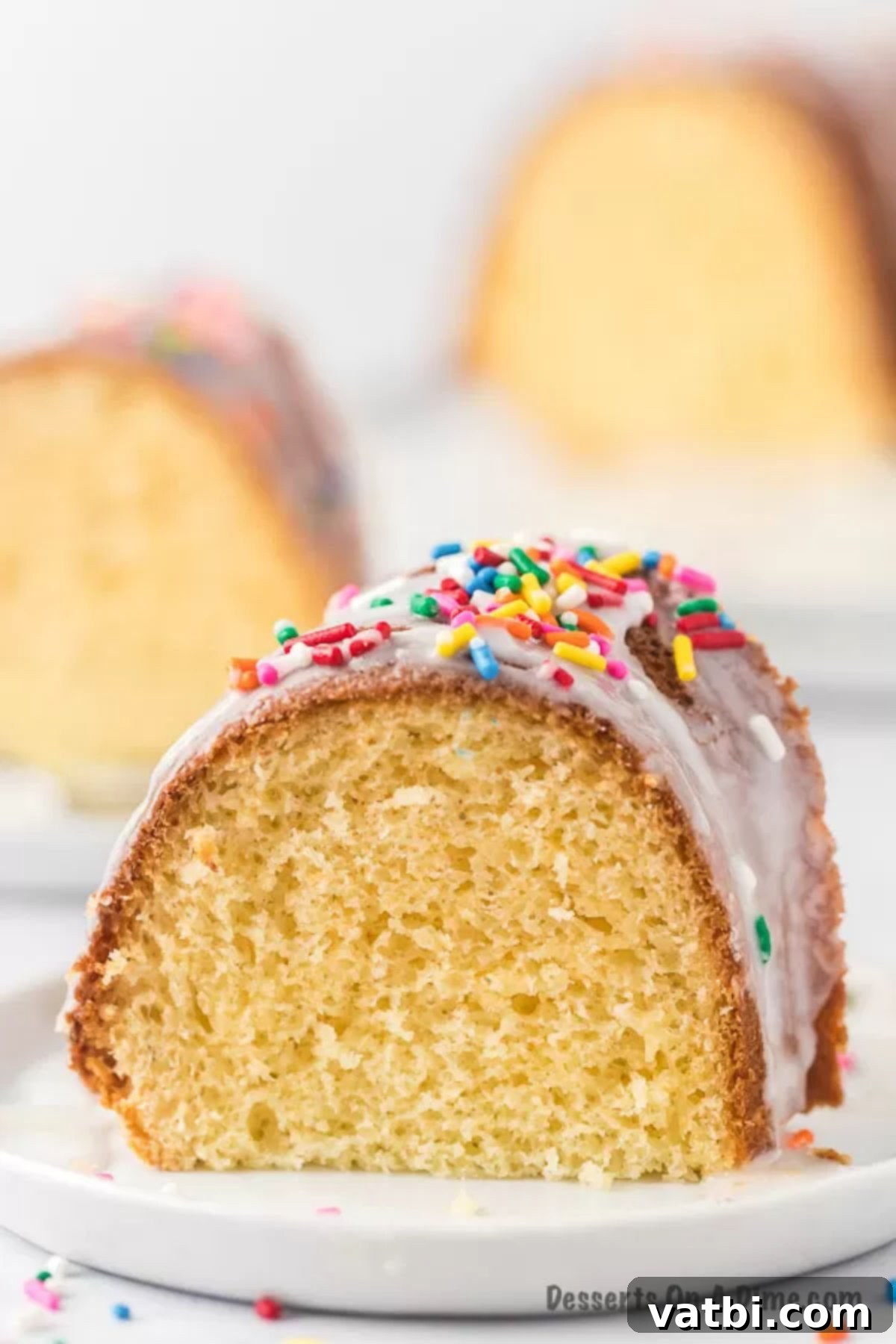Decadent Melted Ice Cream Cake 10 A whole melted ice cream cake with glaze and colorful sprinkles.