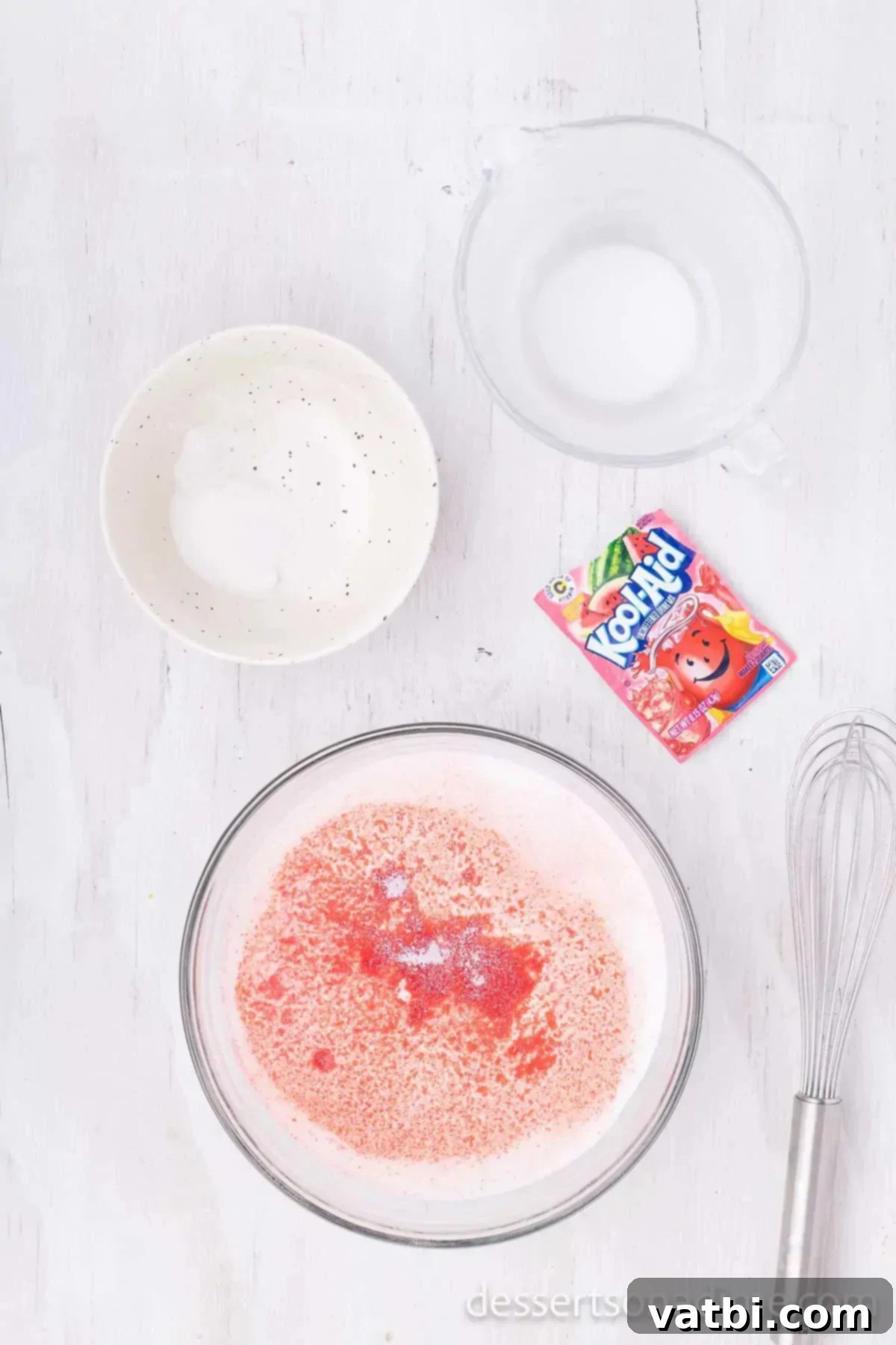 No-Churn Kool-Aid Ice Cream Magic 4 Bowl of kool aid combined with milk and sugar.