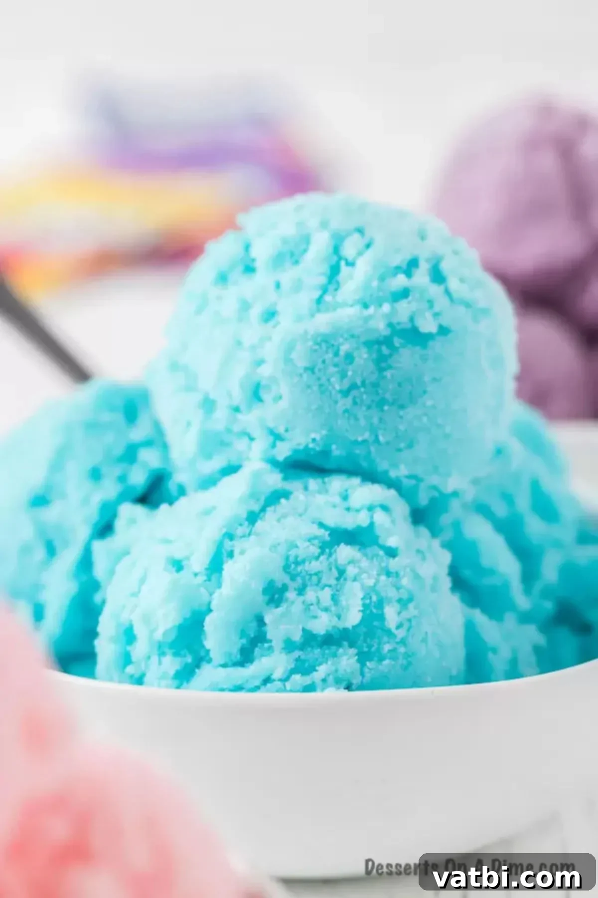 No-Churn Kool-Aid Ice Cream Magic 9 Blue Kool Aid Ice Cream in a white bowl