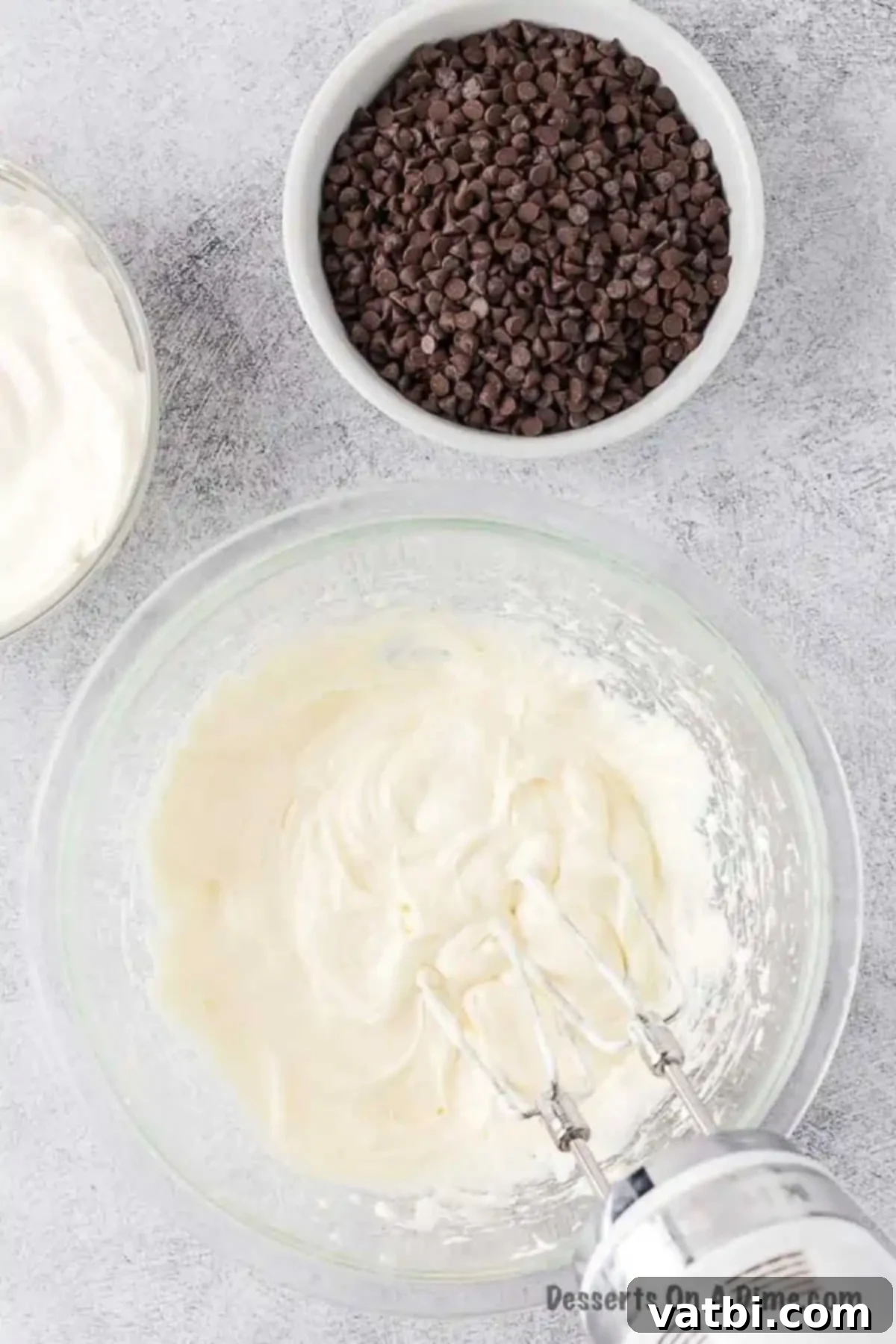 Divine Decadence Dip 3 Mixing bowl with cream cheese and marshmallow.