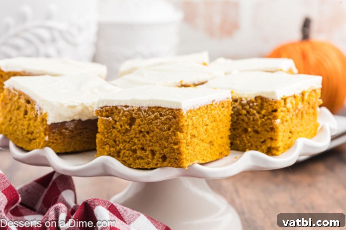 Paula Deen's Signature Pumpkin Bars 2 Pumpkin Bars cut into squares and served on a white platter.