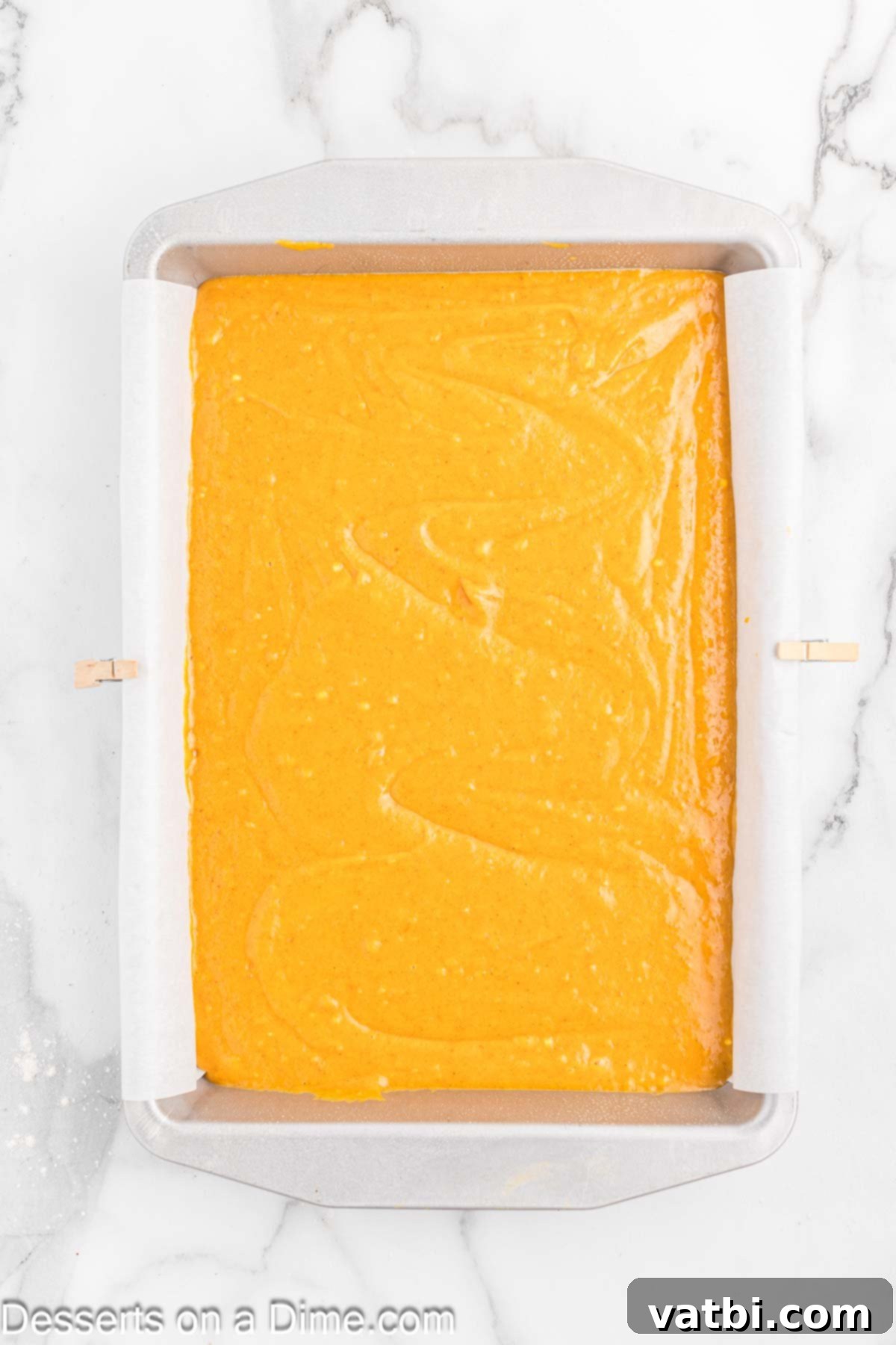 Paula Deen's Signature Pumpkin Bars 8 Batter spread into a baking dish.