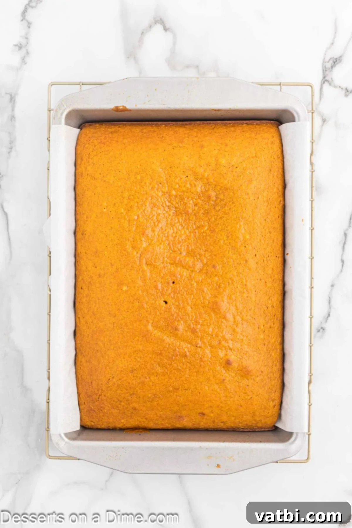 Paula Deen's Signature Pumpkin Bars 9 Pumpkin Bars baked and cooling in pan.