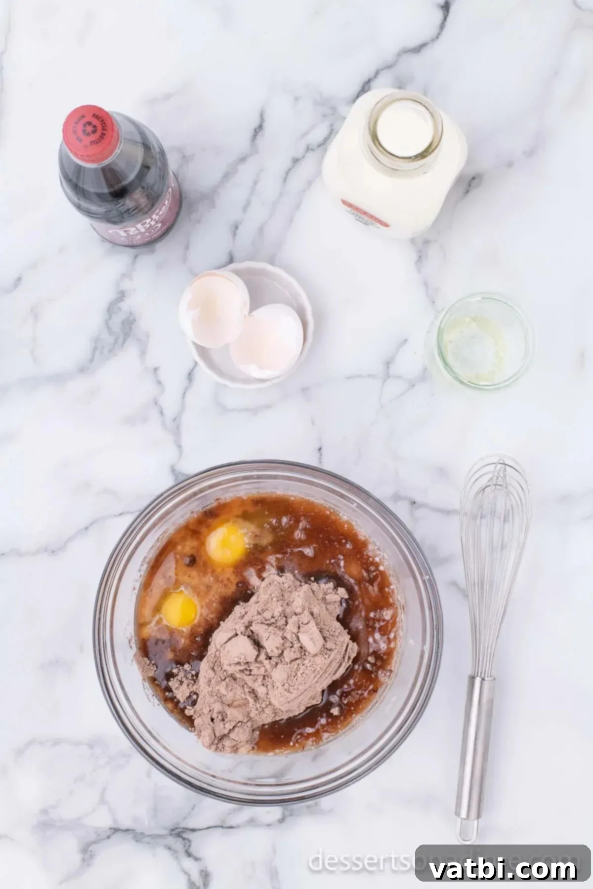 Dark Dr Pepper Decadence 4 Mixing bowl with cake mix ingredients combined in a bowl.
