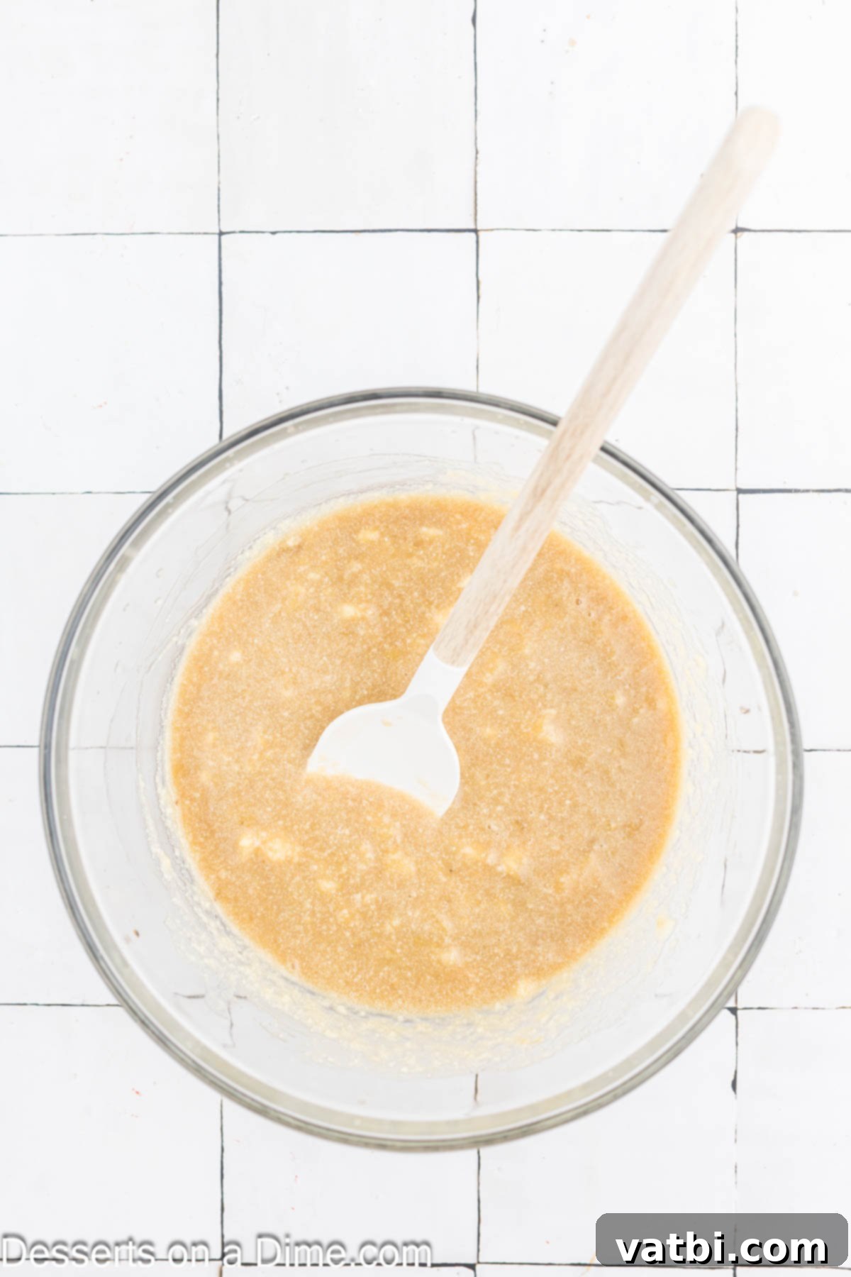 Delicious Banana Oat Bread 5 Mashed ripe bananas and vanilla extract are stirred into the wet ingredients mixture.