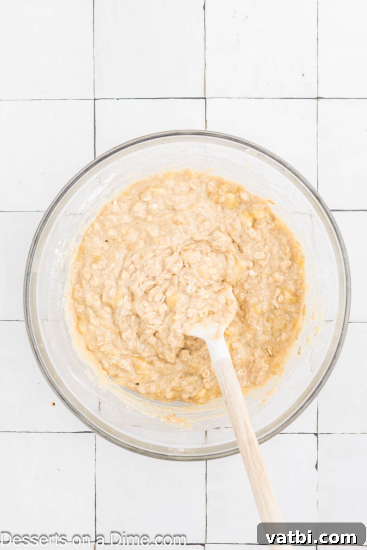 Delicious Banana Oat Bread 7 The combined wet and dry ingredients are mixed in a large bowl until just incorporated.