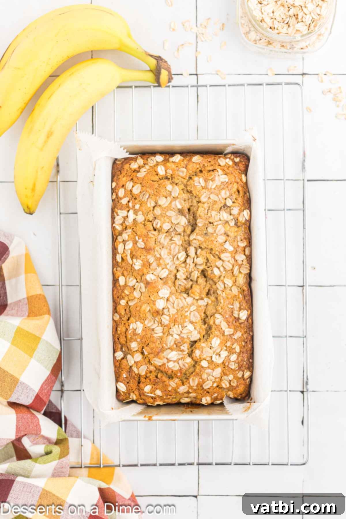 Delicious Banana Oat Bread 9 Baked Oatmeal Banana Bread cooling in the loaf pan after being removed from the oven.