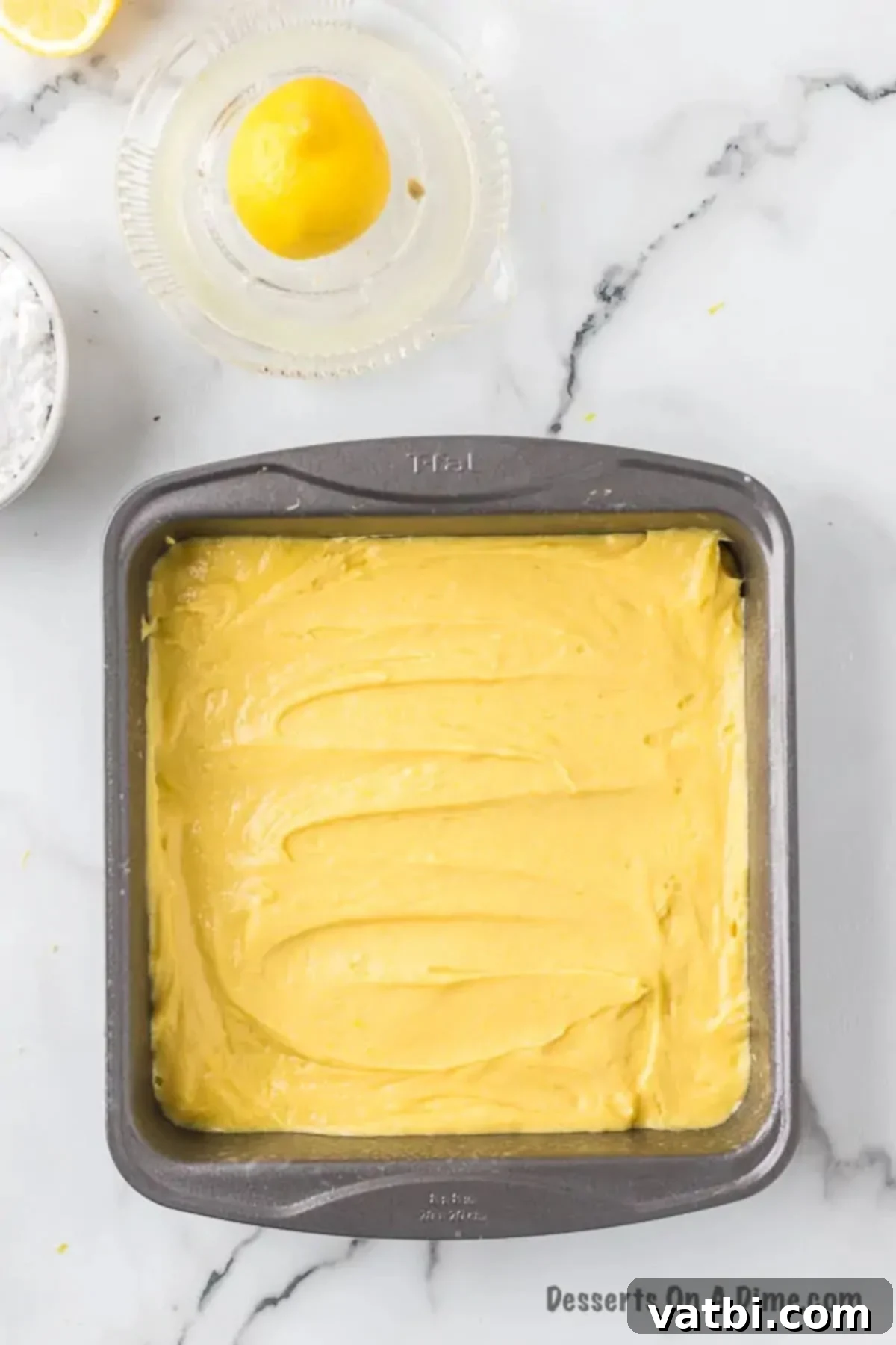 Zesty Lemon Brownie Bliss 8 Lemon brownie batter spread evenly into the prepared baking pan.