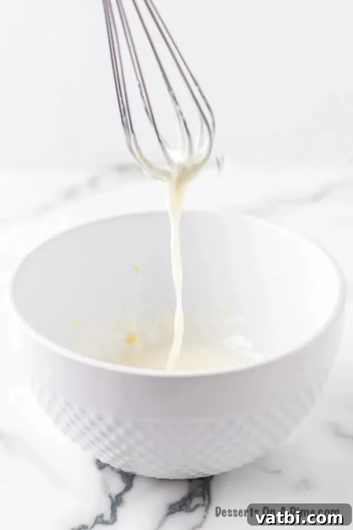 Zesty Lemon Brownie Bliss 9 Bowl with powdered sugar, fresh lemon juice, and lemon zest for the glaze.