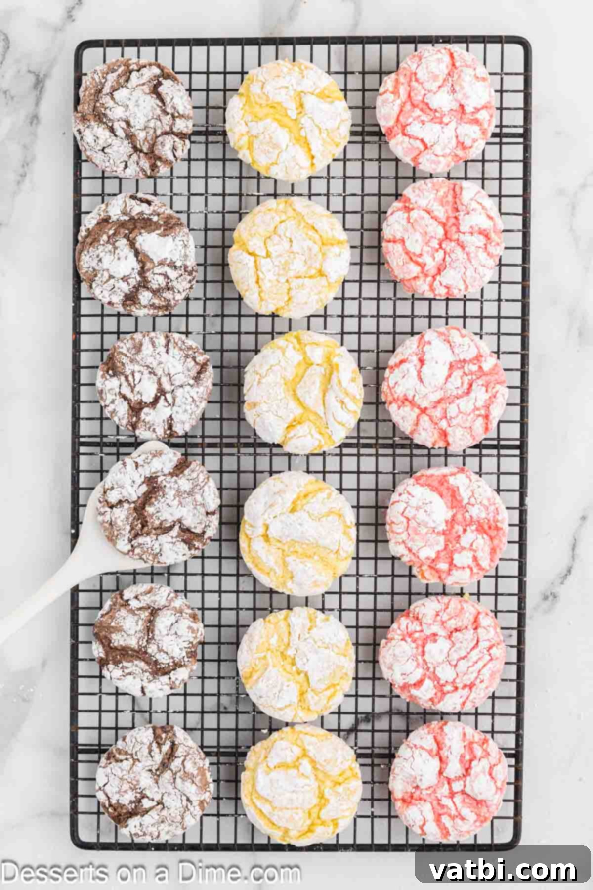 Fluffy Cool Whip Cookies 7 Cool Whip Cake Mix Cookies fully cooled on a wire rack, showcasing their fluffy texture and powdered sugar coating.