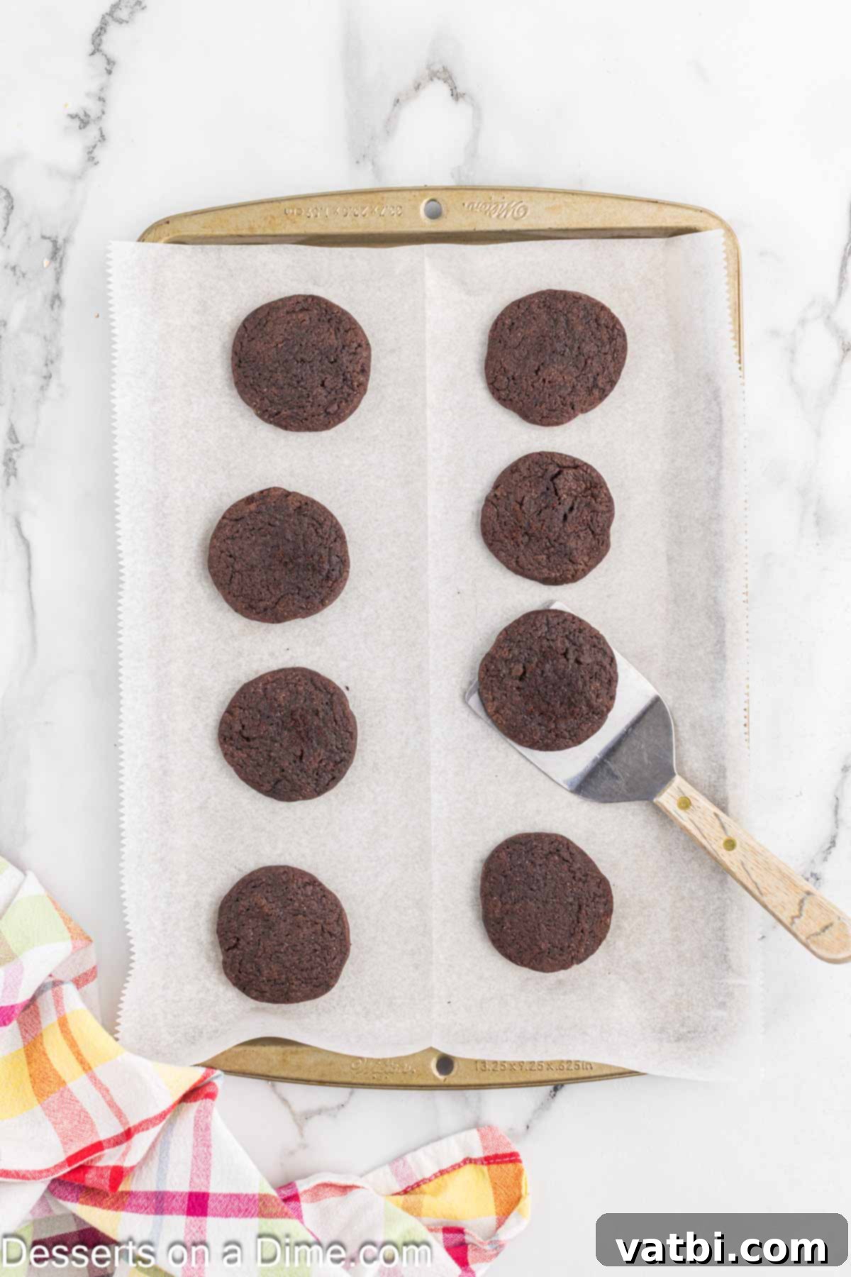 Layered Chocolate Delights 11 Freshly baked chocolate wafer cookies cooling on a wire rack after being removed from the baking sheet.
