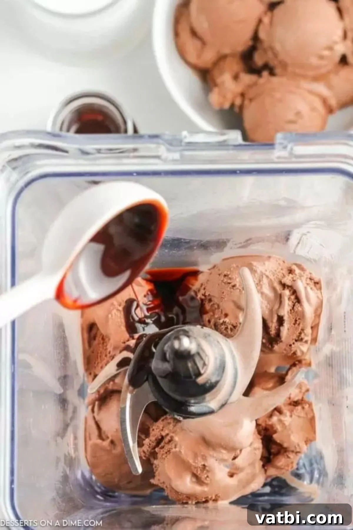 Decadent Chocolate Milkshake 5 Chocolate sauce in blender with ice cream.