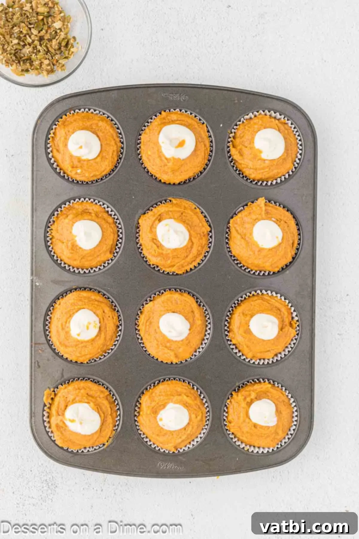 Starbucks Autumn Pumpkin Cream Cheese Muffins 11 Cream cheese filling dolloped in the center of each muffin.