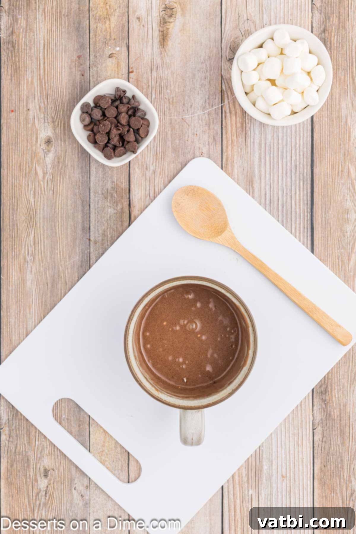 Decadent Hot Chocolate Mug Cake 4 Cake ingredients combined together in a mug.