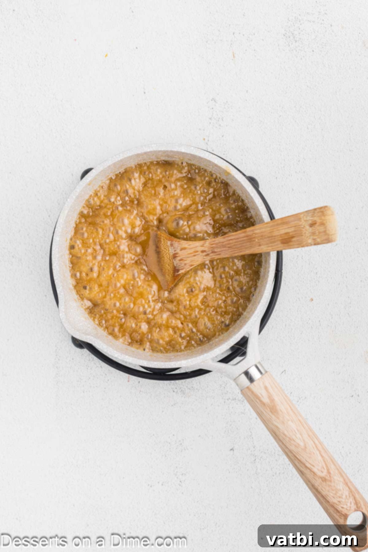 Brown sugar and butter simmering in a saucepan.