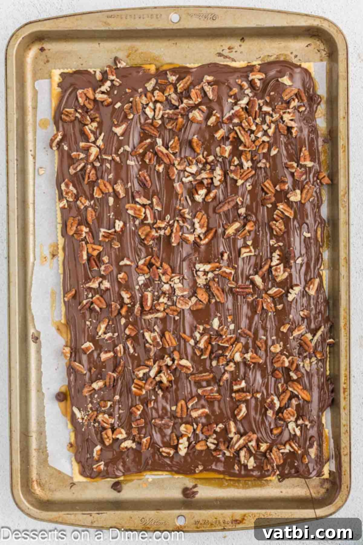 Chopped nuts sprinkled over the melted chocolate.