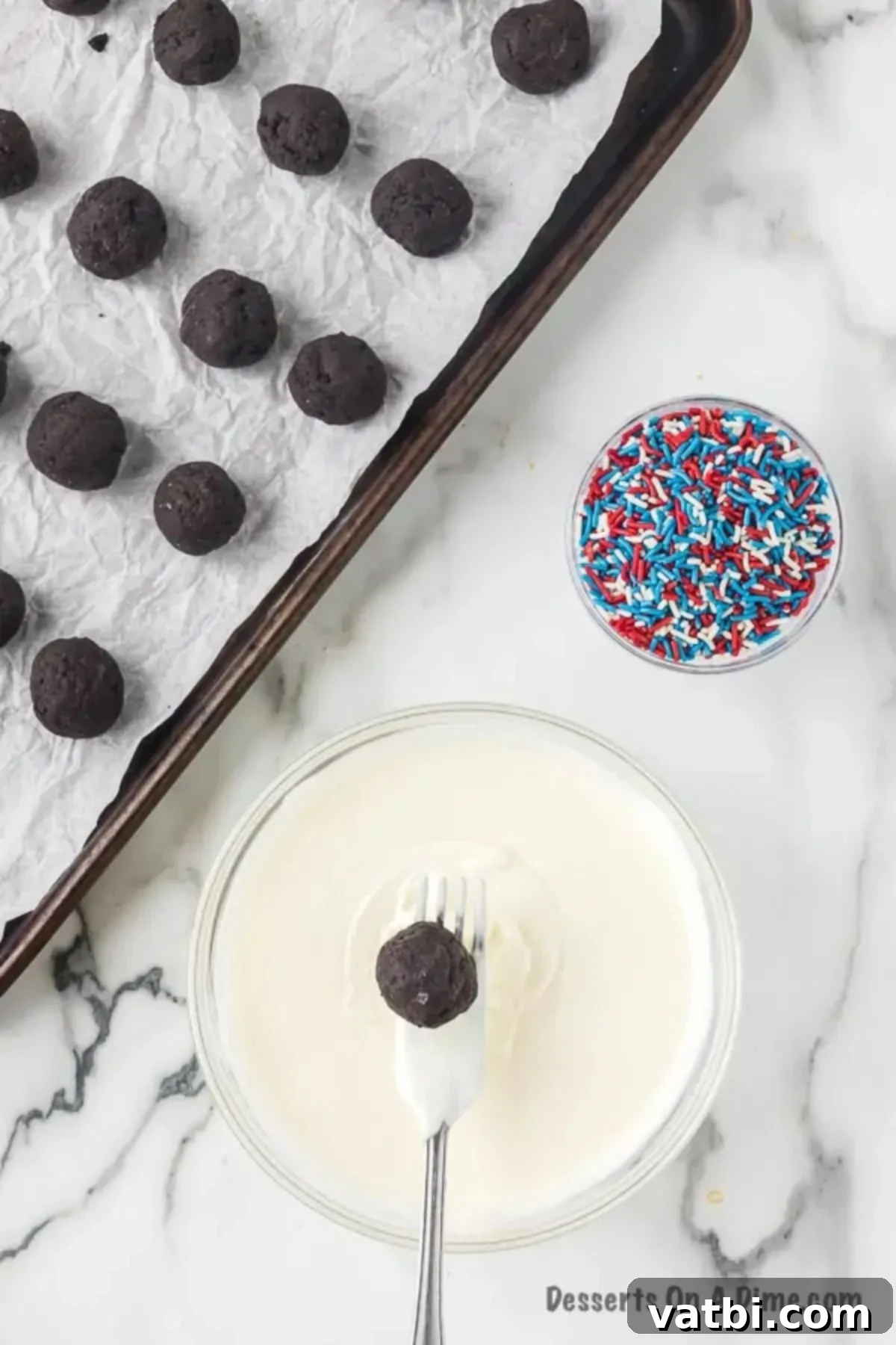 Star-Spangled Oreo Truffles 7 Smoothly melted white almond bark in a microwave-safe bowl, ready for dipping the Oreo Balls.