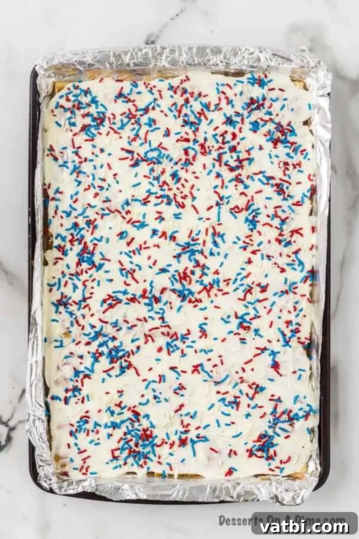 Sprinkles on top of melted chocolate. 