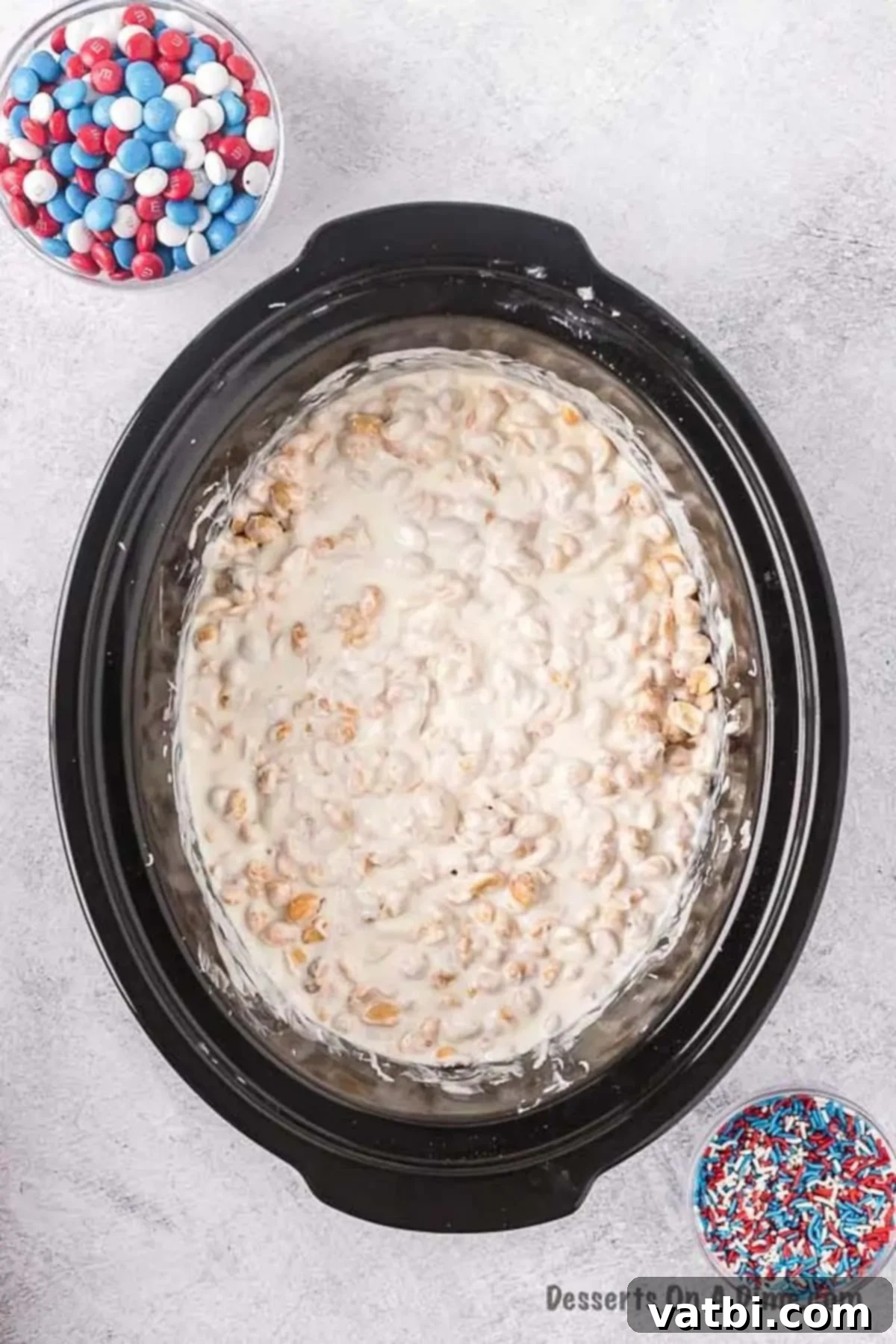 One-Pot Patriotic Peanut Clusters 5 Mixture melted in crock pot.