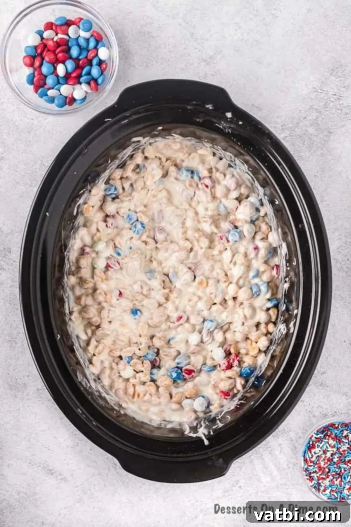 One-Pot Patriotic Peanut Clusters 6 Chocolate folded into melted mixture in the crock pot.