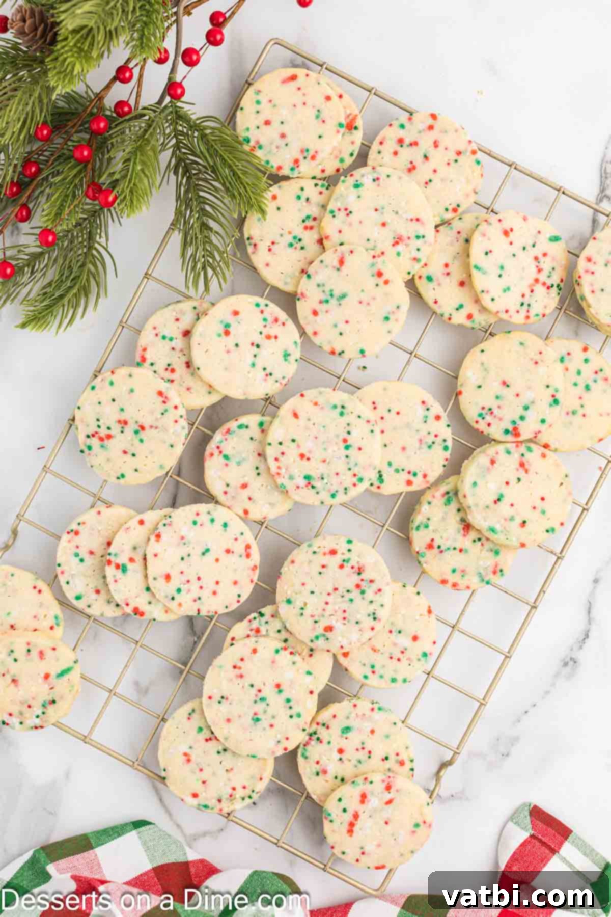 Yuletide Shortbread Delights 9 Freshly baked Shortbread Christmas Cookies cooling on a wire rack.
