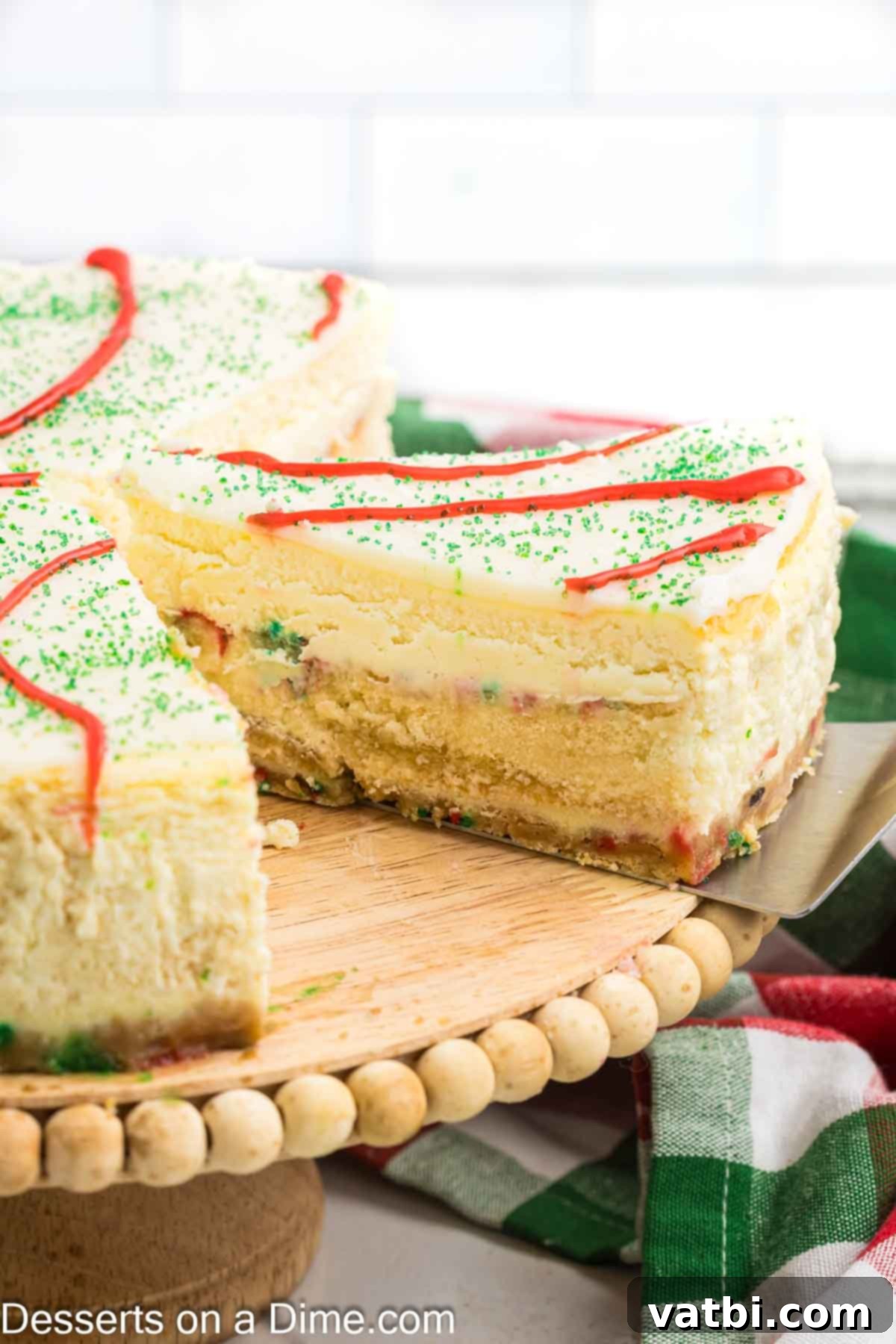 Little Debbie Christmas Tree Cheesecake: A Festive Indulgence 17 A slice of Little Debbie Christmas Tree Cheesecake being cut, revealing the cakes baked within.