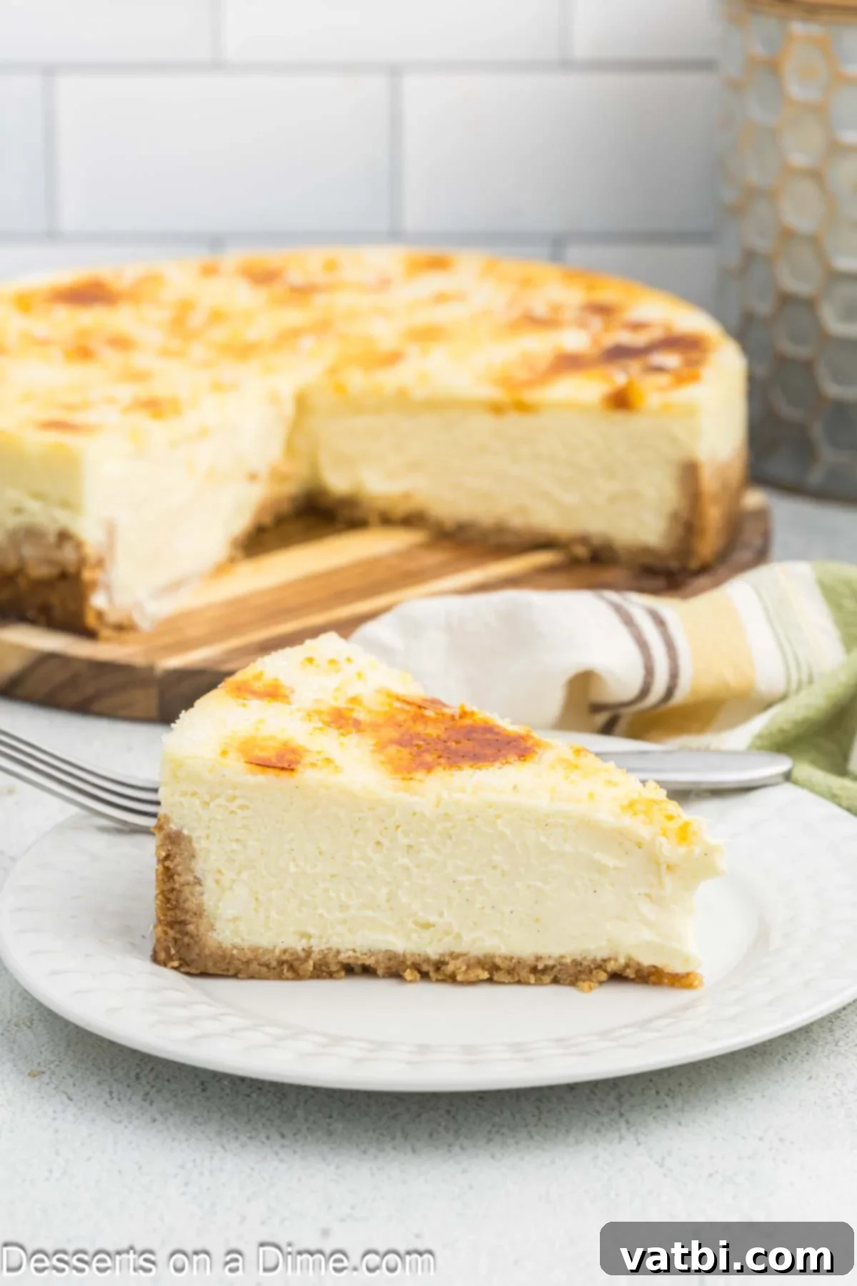 Golden Crown Cheesecake 2 A delicious slice of Cheesecake Brulee being served, showcasing its creamy interior and golden caramelized top.