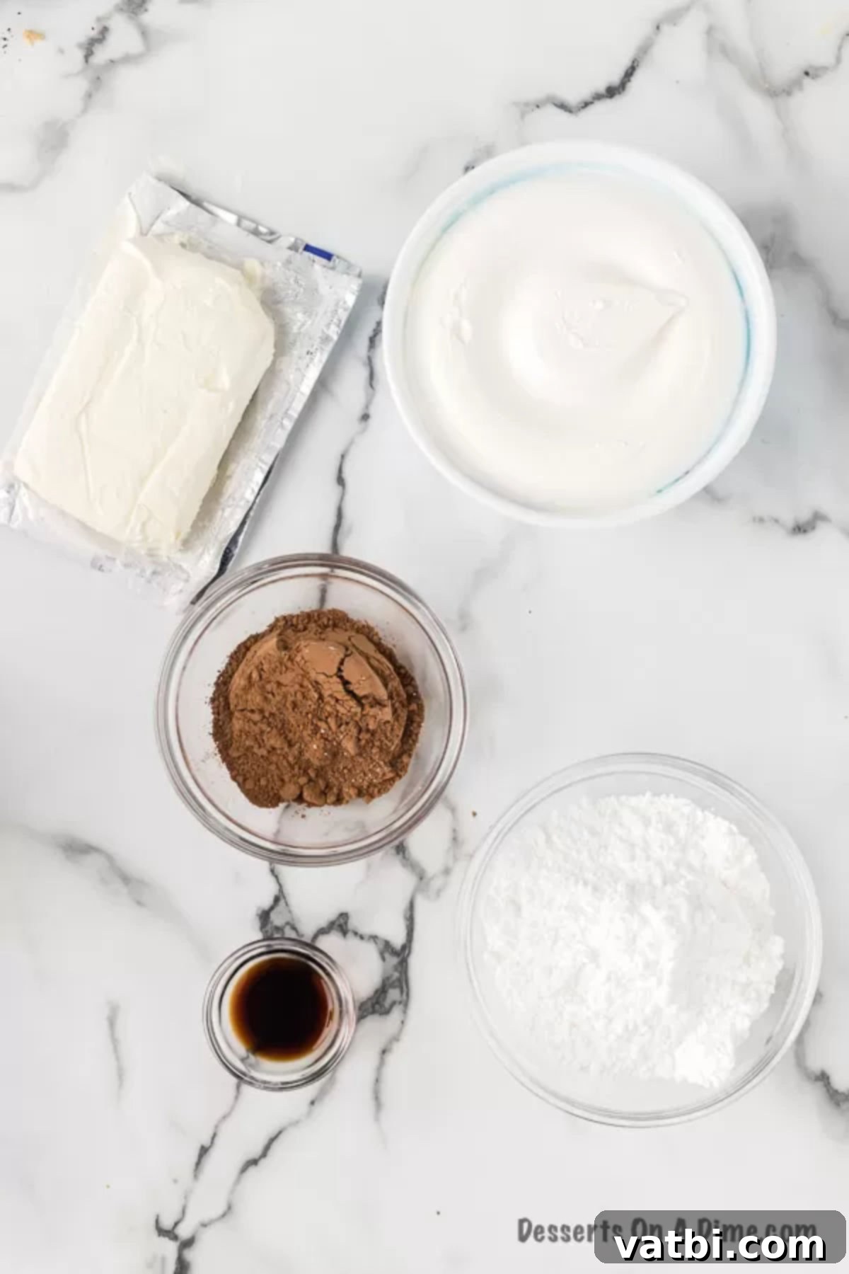 Chocolatey Fruit Indulgence 3 Essential ingredients for chocolate fruit dip laid out: softened cream cheese, powdered sugar, unsweetened cocoa powder, and whipped topping in their original packaging.
