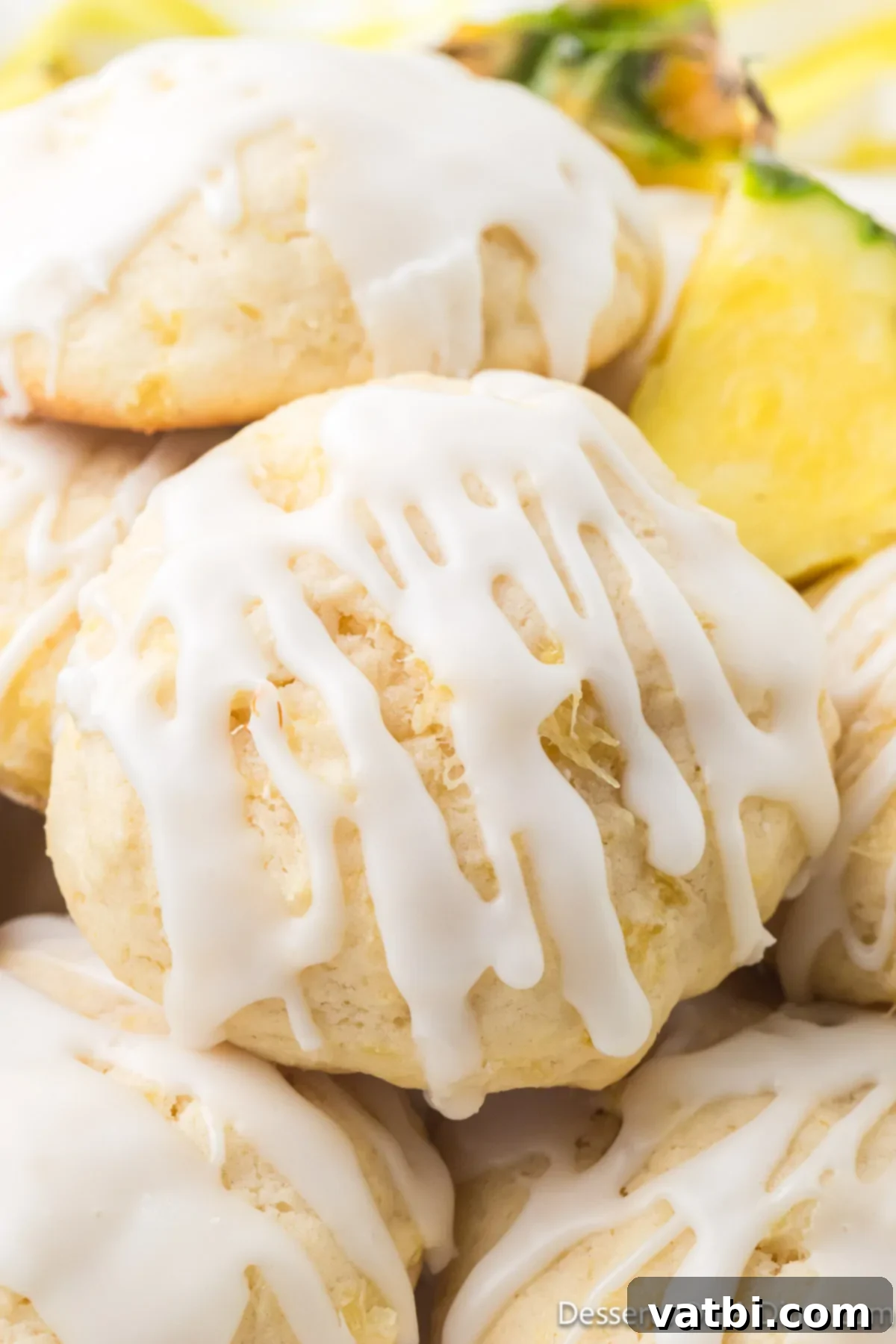 Stacked Pineapple Cookies with a dusting of powdered sugar and visible crushed pineapple in the cookie texture.