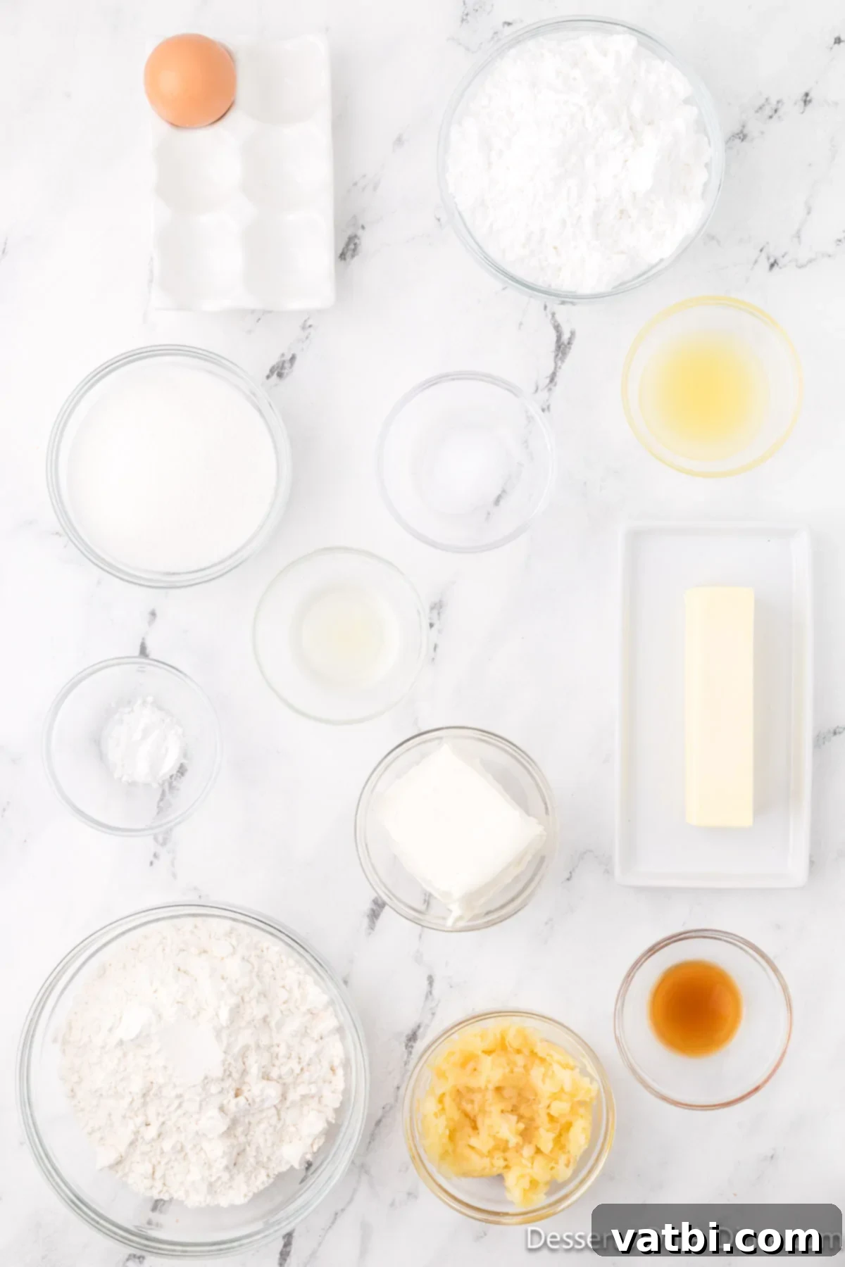 Ingredients for Pineapple Cookies laid out: flour, salt, cream cheese, butter, eggs, vanilla, pineapple juice, crushed pineapple, powdered sugar.
