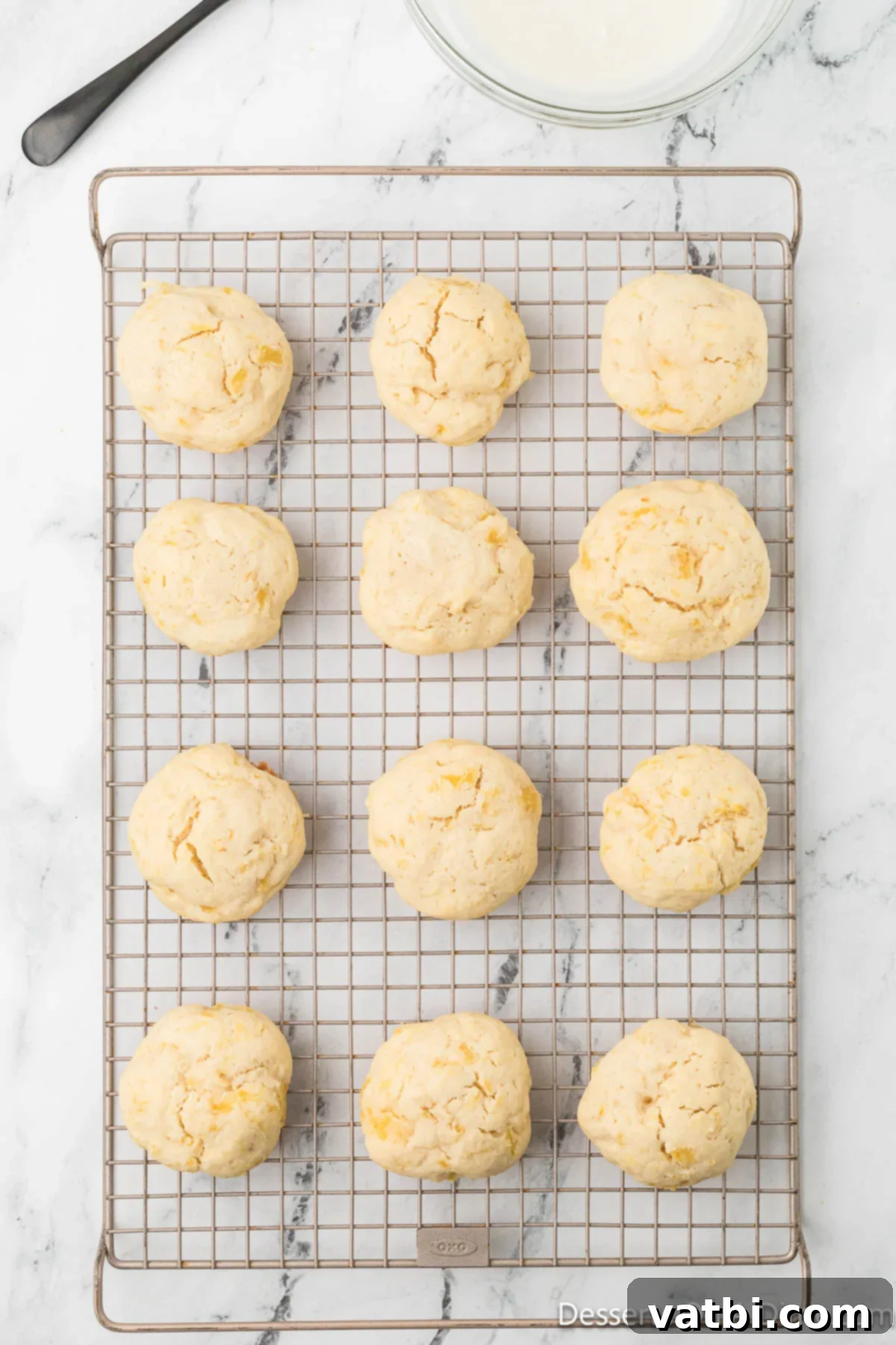 Warm pineapple cookies transferred to a wire rack to cool completely.