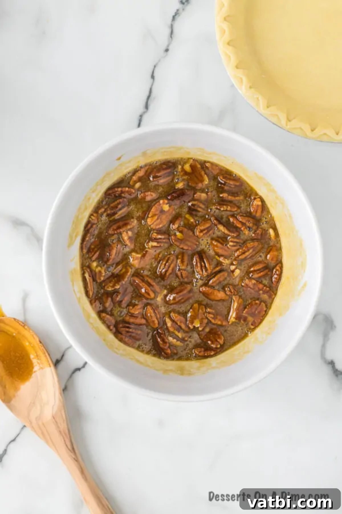Effortless Pecan Pie Perfection 5 Pecans folded into the mixture.