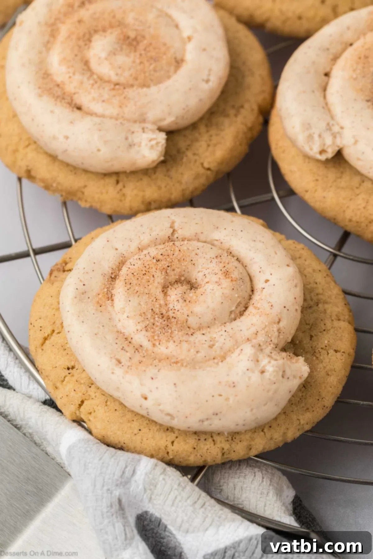 Churro Cookie Bliss 2 Churro Cookies topped with frosting on a wire rack.