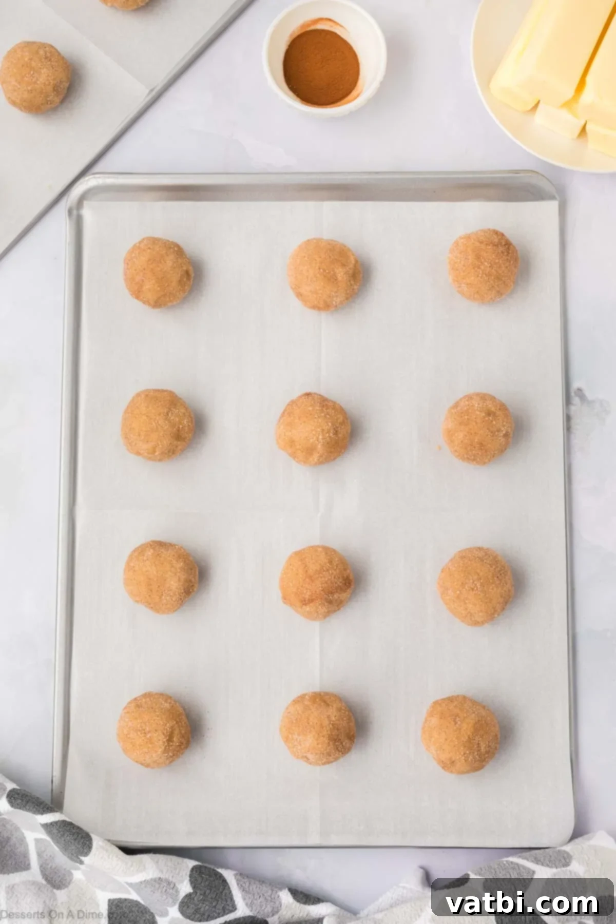 Churro Cookie Bliss 11 Cookie dough balls on baking sheet.