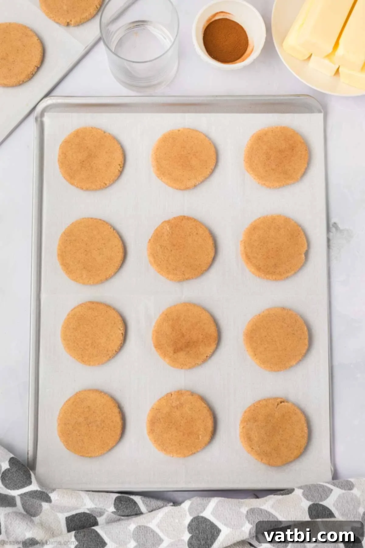 Churro Cookie Bliss 12 Cookies flattened on baking sheet.