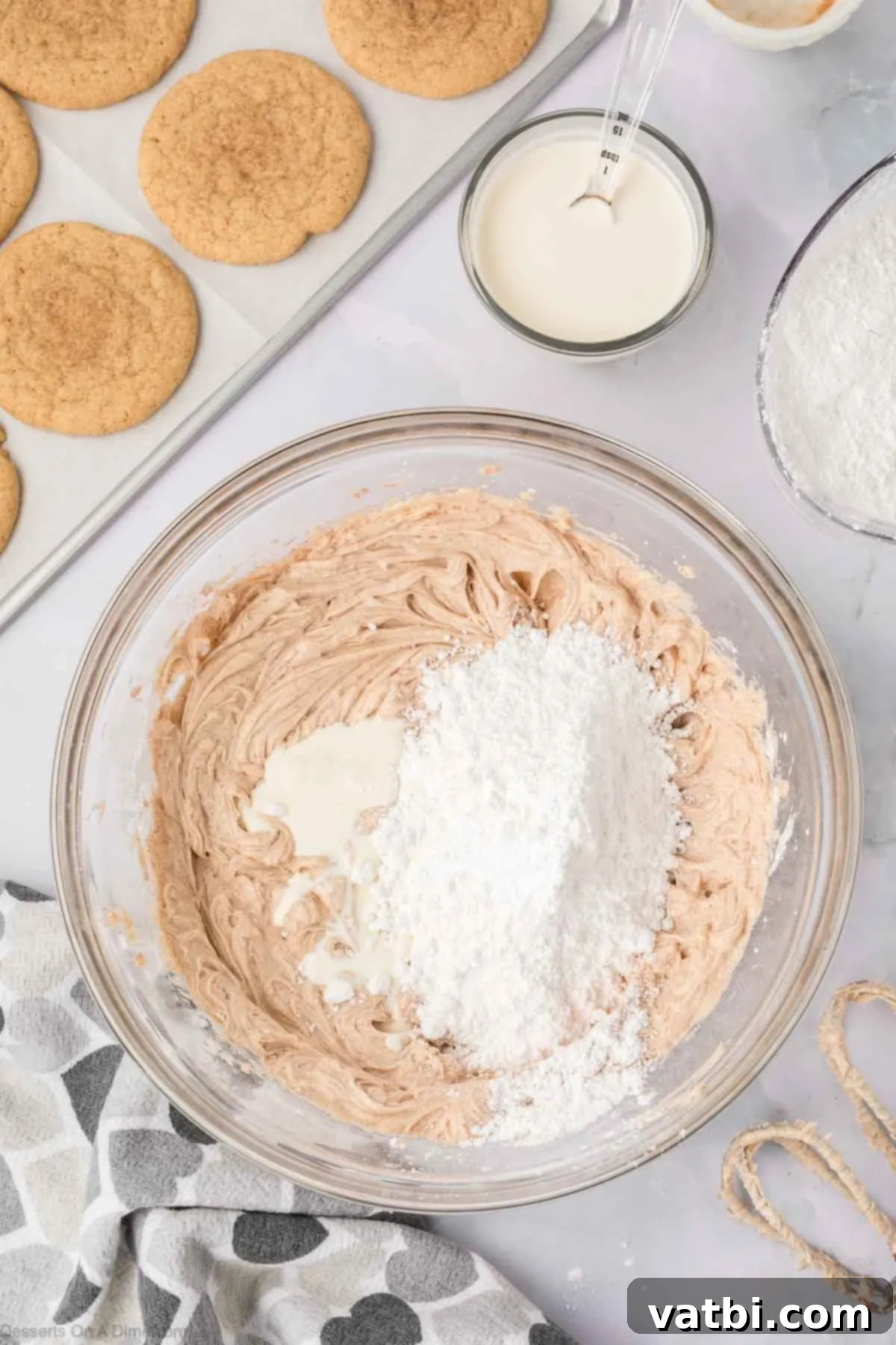 Churro Cookie Bliss 14 Frosting mixture with powdered sugar in a bowl.