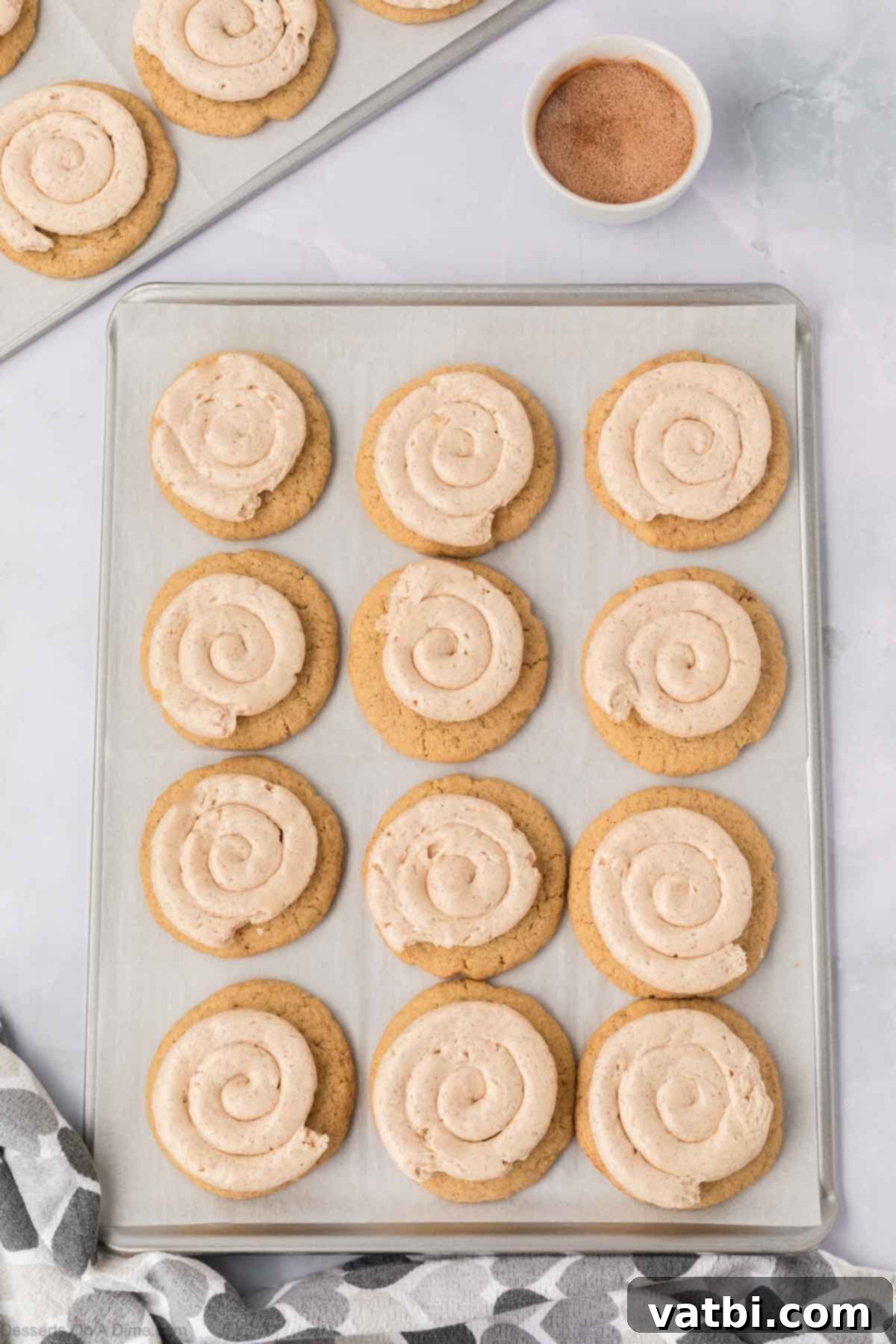 Churro Cookie Bliss 17 Frosting piped on to the cookies.
