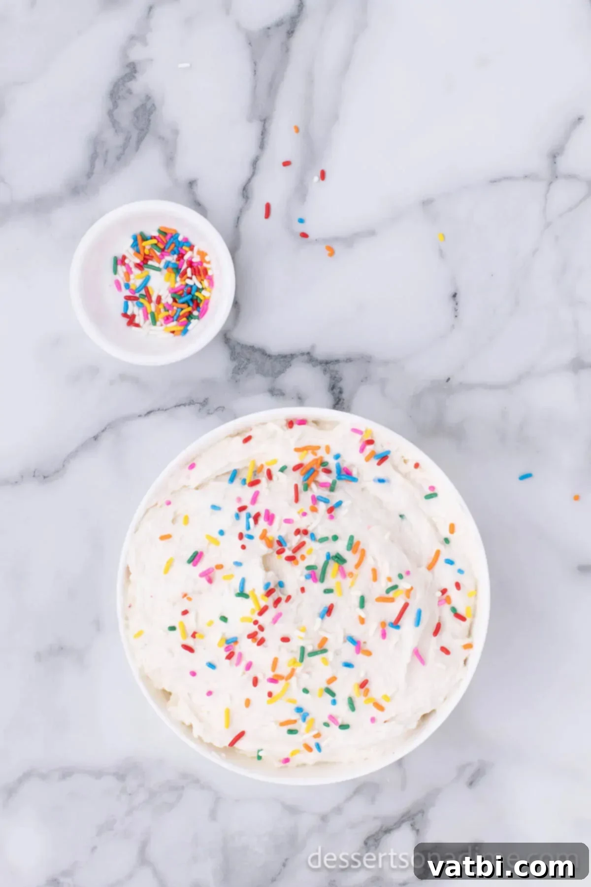 Party Cake Batter Delight 7 The fully mixed Funfetti Cake Batter Dip transferred into a decorative serving bowl and garnished with an abundance of colorful sprinkles on top.