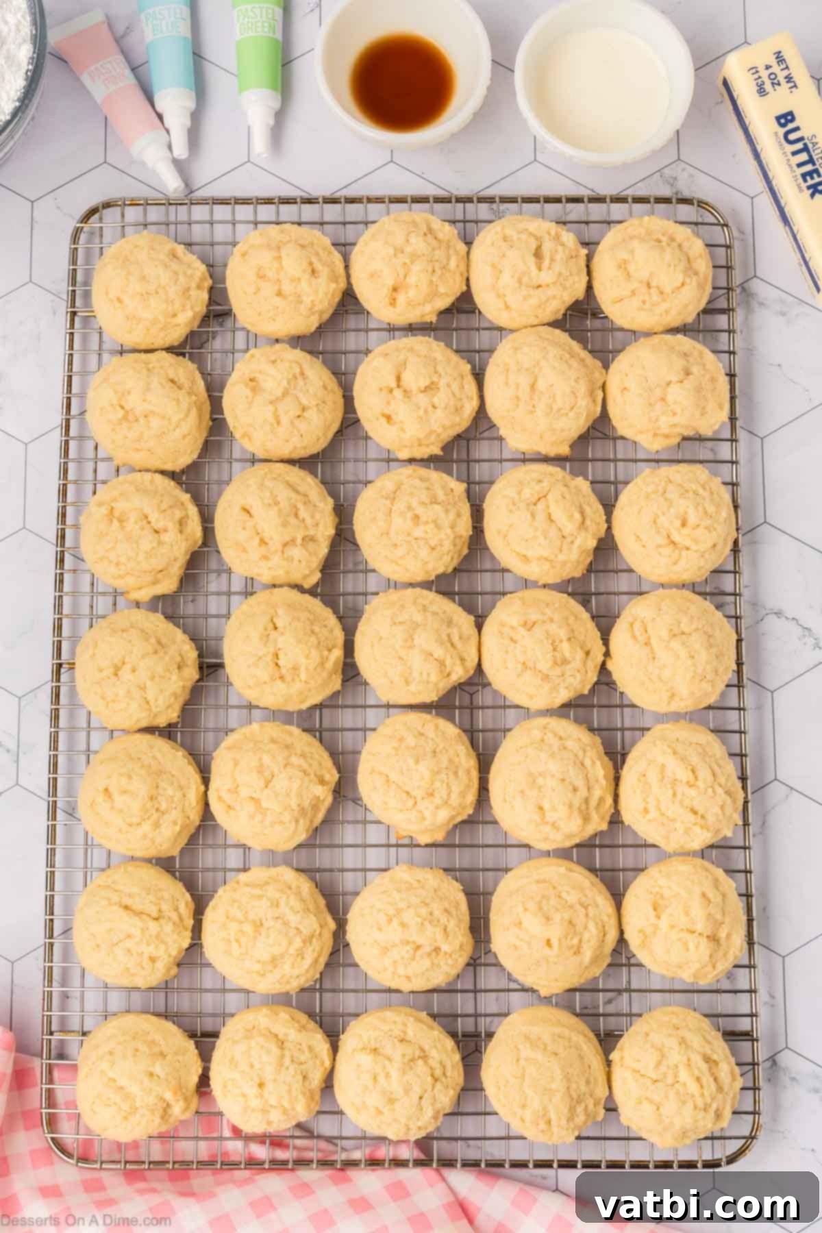 Soft Sour Cream Sugar Cookies 11 Sour Cream Sugar Cookies cooling on a wire rack after baking.