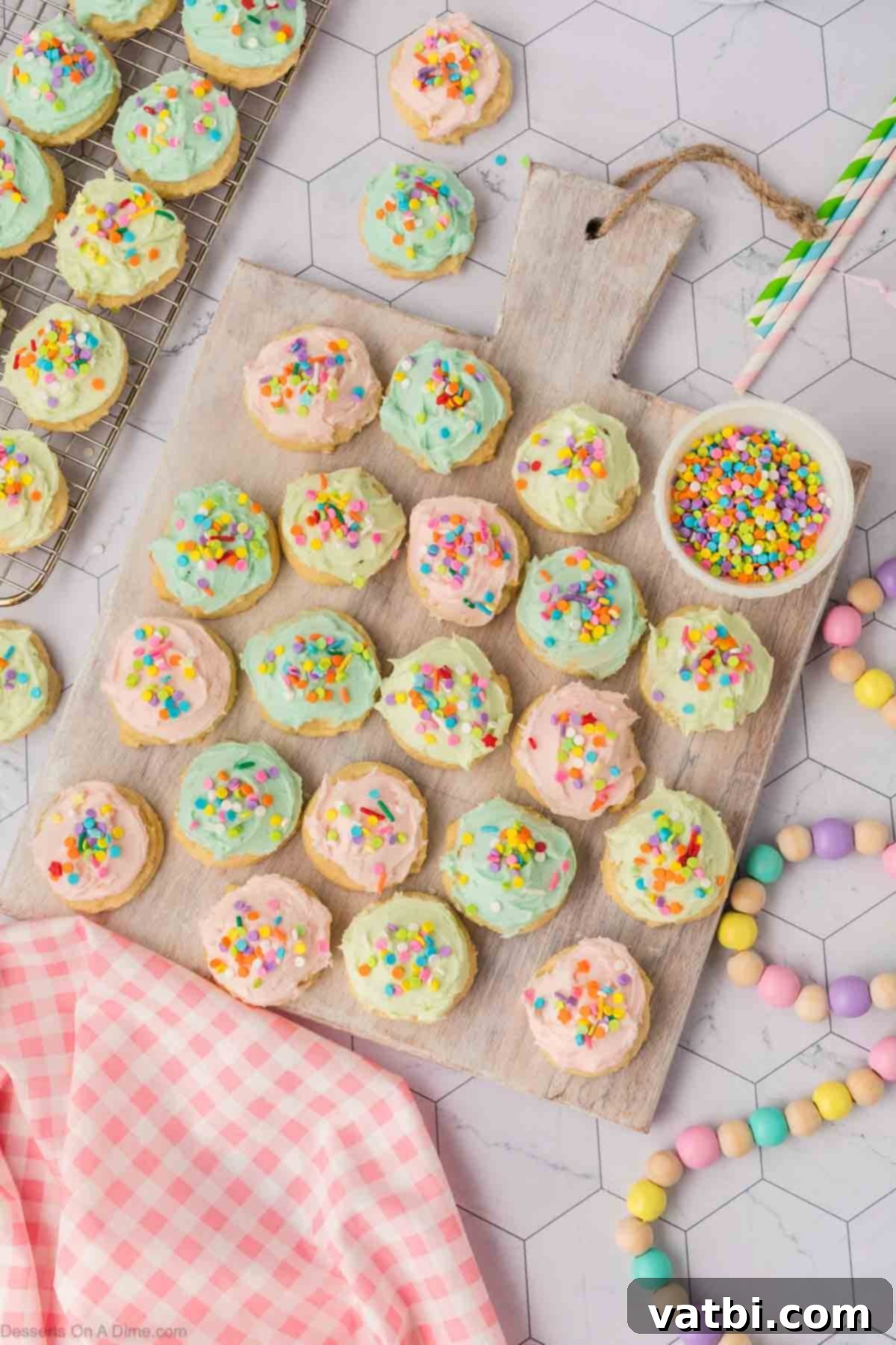 Soft Sour Cream Sugar Cookies 15 Frosted sugar cookies on a platter, ready to be served.