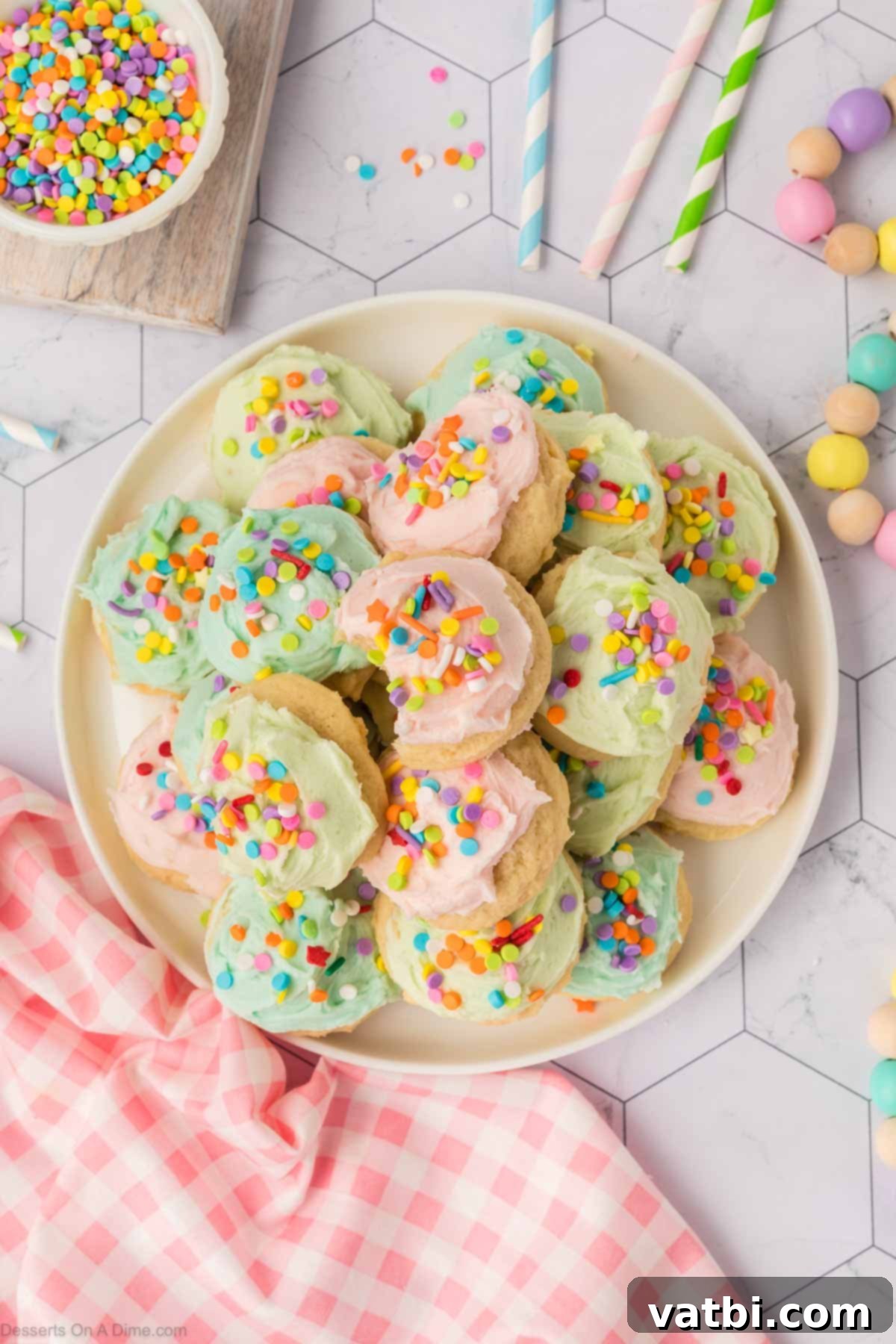 Soft Sour Cream Sugar Cookies 16 Frosted sugar cookies displayed beautifully on a platter, ready for guests.